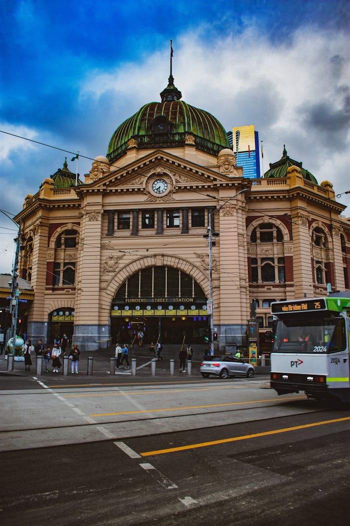 Flinders Street Station in Melbourne, known for its distinctive dome and vibrant architecture.