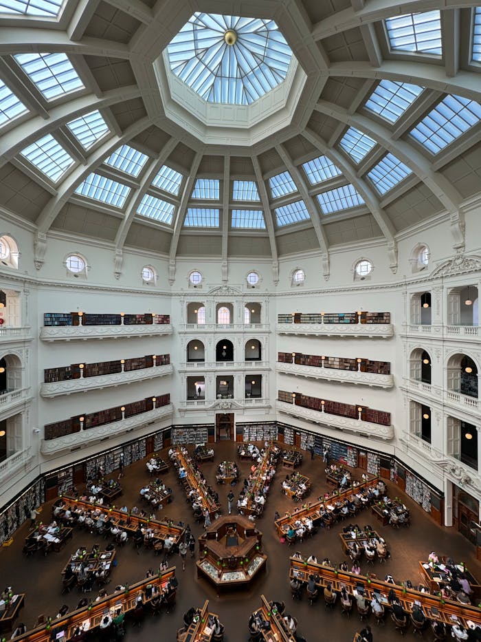 services-04 Interior view of the grand State Library Victoria, Melbourne, featuring its iconic domed ceiling.